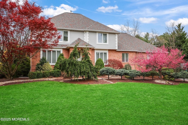 191 Robertsville Rd, Freehold, NJ 07728 - back of house featuring a lawn, a shingled roof, brick siding, and stucco siding