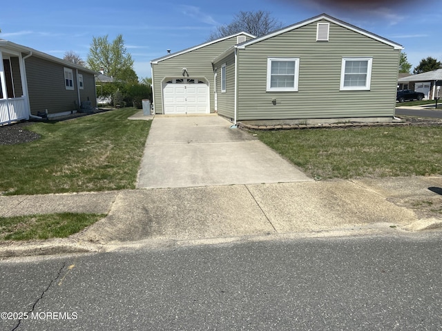 view of front of property with a garage, driveway, and a front yard
