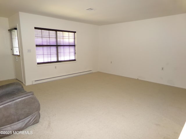 unfurnished living room with visible vents, carpet, and a baseboard radiator