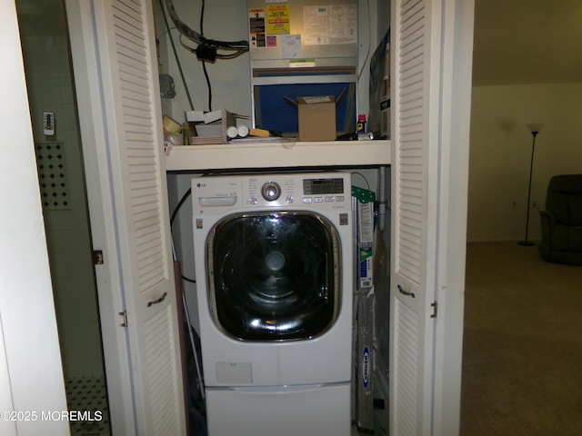 laundry room with carpet, laundry area, and washer / clothes dryer