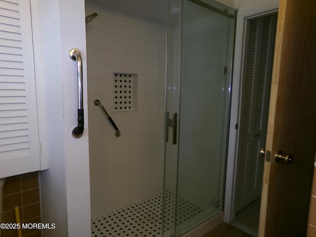 bathroom with a shower stall