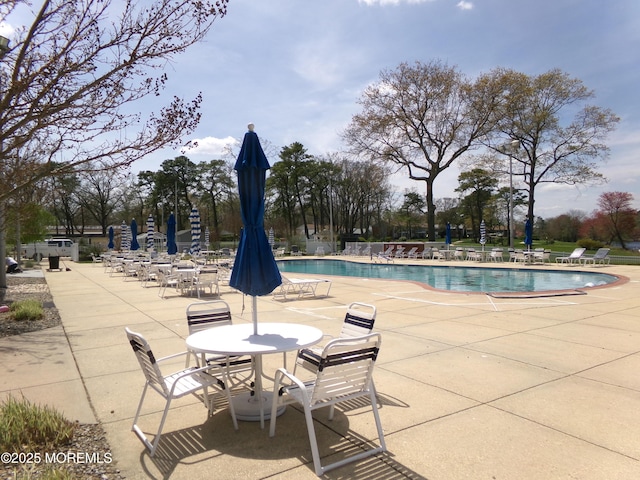 pool with a patio area