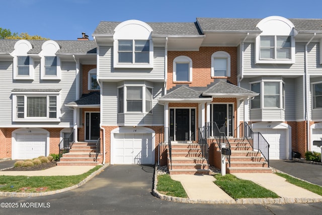 65 E River Rd Unit 14, Rumson, NJ 07760 - multi unit property with brick siding, driveway, roof with shingles, and a garage