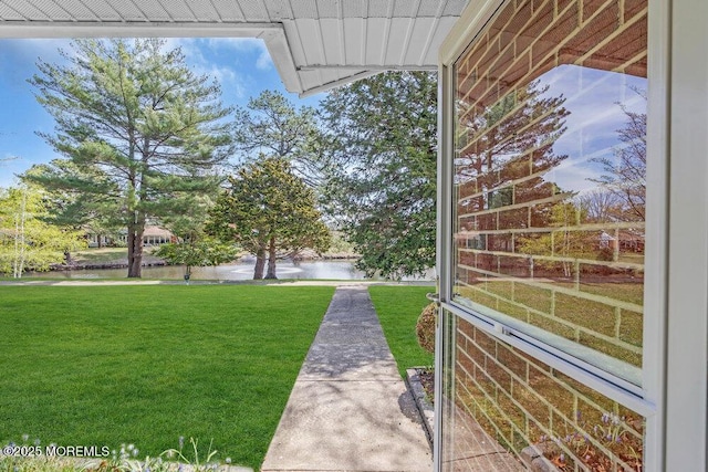 view of yard with a water view