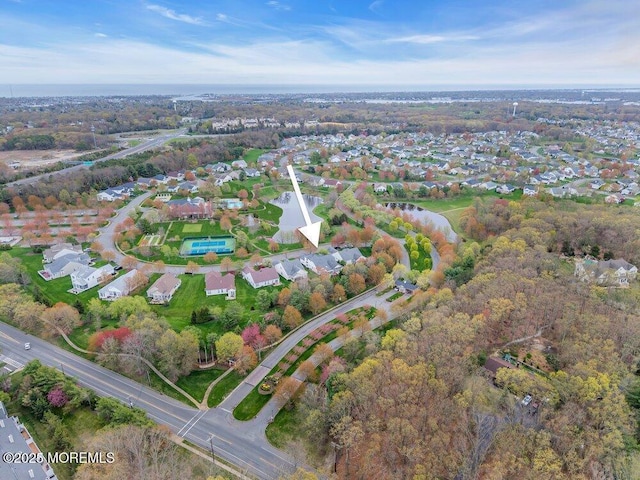 aerial view featuring a water view and a residential view
