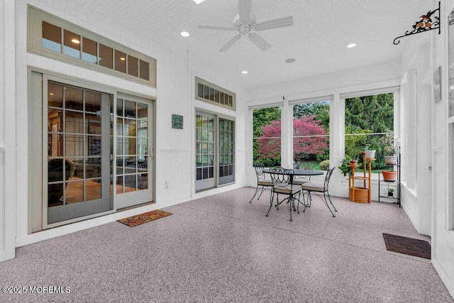 sunroom / solarium featuring recessed lighting