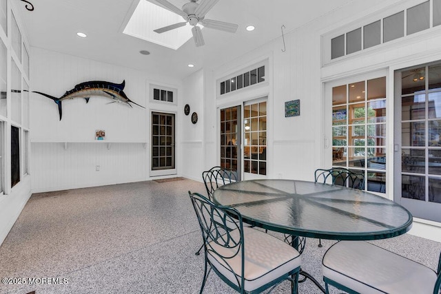 exterior space with outdoor dining area and ceiling fan