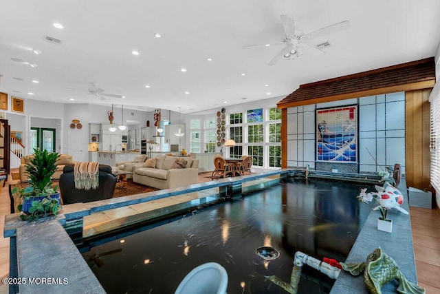 rec room featuring ceiling fan, recessed lighting, and visible vents