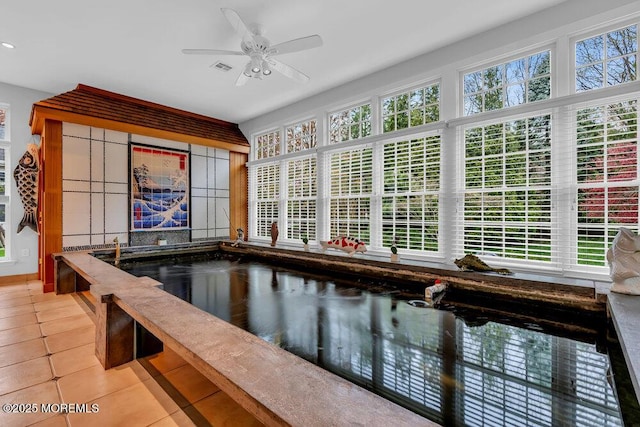 view of pool with ceiling fan