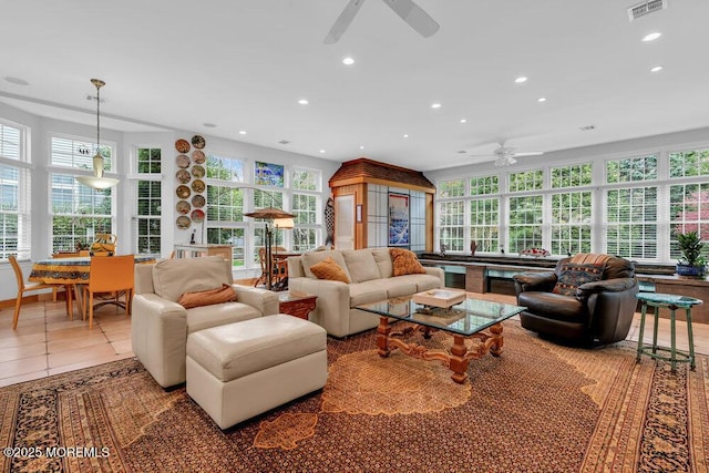 tiled living room featuring a ceiling fan, recessed lighting, and visible vents