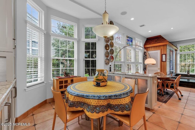 dining area with light tile patterned floors, baseboards, recessed lighting, and visible vents