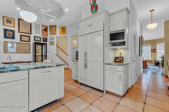 kitchen with ornamental molding, light tile patterned flooring, ceiling fan, recessed lighting, and a sink