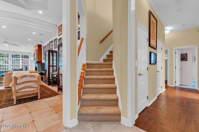 staircase featuring crown molding, baseboards, ceiling fan, and recessed lighting