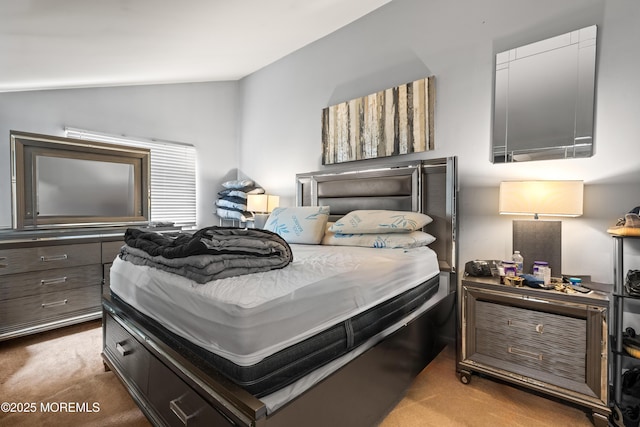 carpeted bedroom with vaulted ceiling