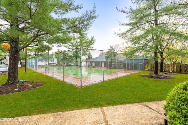 exterior space featuring a lawn and fence