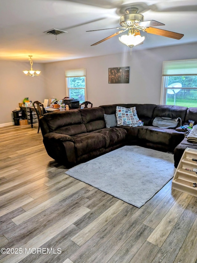 59 Chilton Ln, Aberdeen, NJ 07747 - living area featuring wood finished floors, a chandelier, and ceiling fan