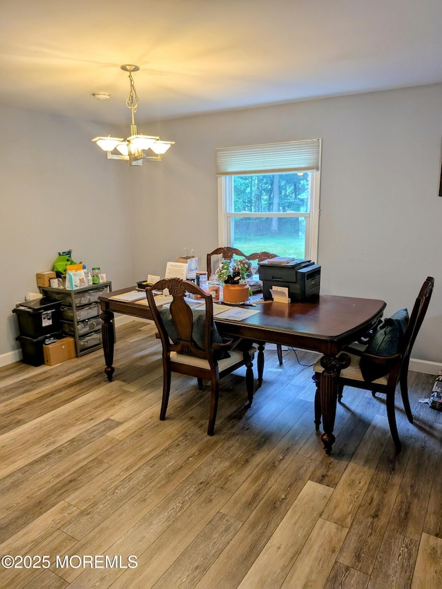 59 Chilton Ln, Aberdeen, NJ 07747 - dining area with light wood-style floors and a chandelier