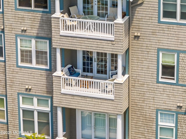 rear view of property featuring a balcony