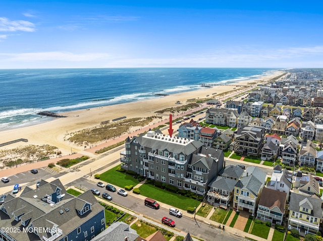 bird's eye view of waterfront with a beach