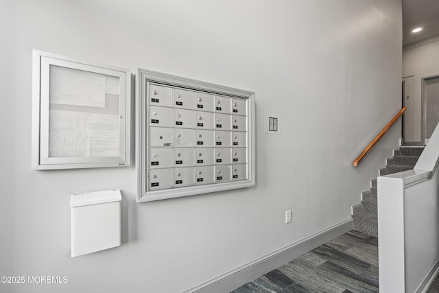 stairway featuring recessed lighting, baseboards, and mail area