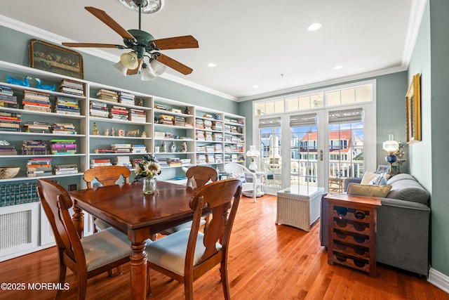 dining room with ceiling fan, ornamental molding, recessed lighting, and wood finished floors