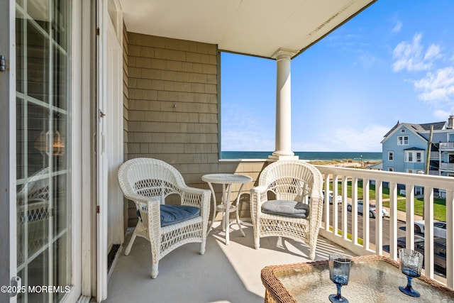 balcony featuring a water view