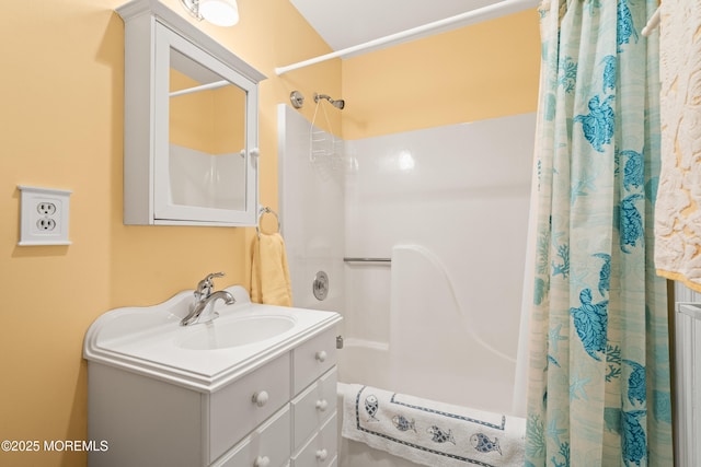bathroom with vanity and shower / tub combo with curtain