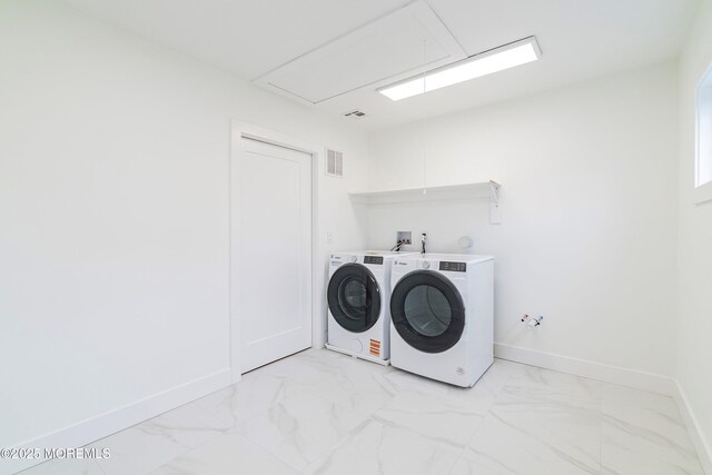laundry area with marble finish floor, laundry area, visible vents, independent washer and dryer, and attic access