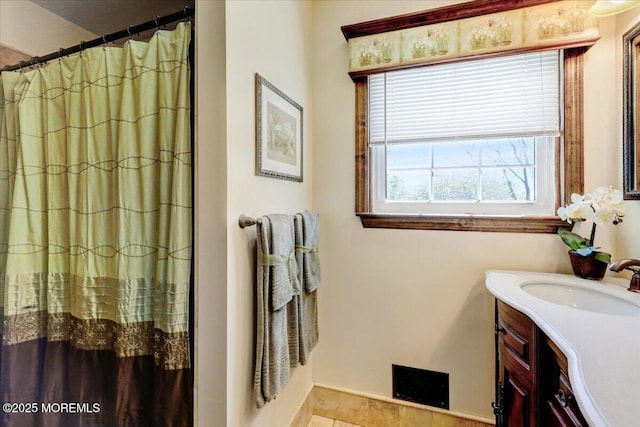 bathroom featuring vanity, baseboards, and a shower with curtain