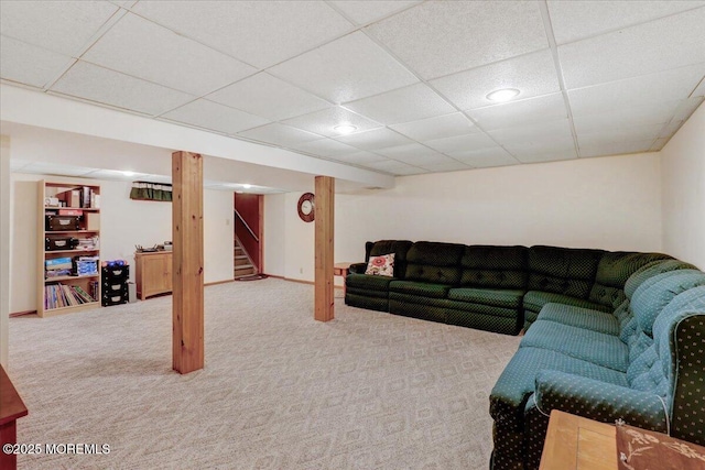 carpeted living room with recessed lighting, a paneled ceiling, and stairway
