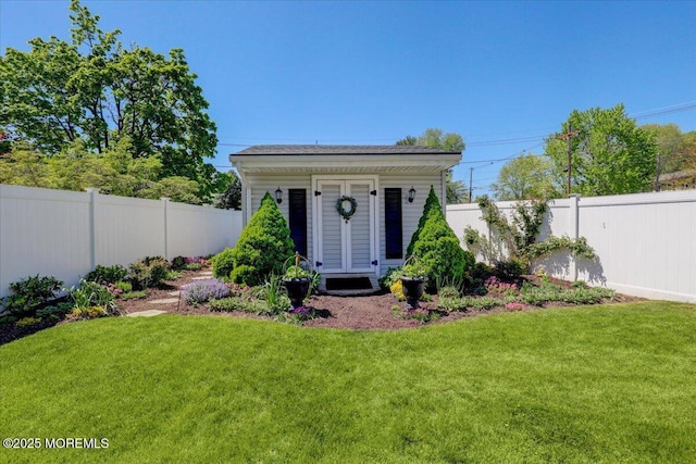 view of outdoor structure featuring a fenced backyard