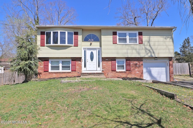 330 Dallas Dr, Toms River, NJ 08753 - raised ranch with brick siding, fence, a front yard, and a garage