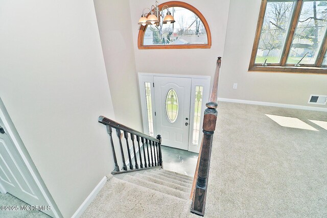 330 Dallas Dr, Toms River, NJ 08753 - foyer with baseboards, visible vents, a chandelier, stairway, and carpet floors