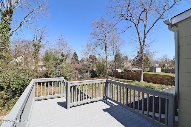 330 Dallas Dr, Toms River, NJ 08753 - deck with a fenced backyard, an outdoor structure, and a storage shed