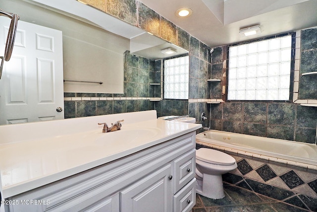 330 Dallas Dr, Toms River, NJ 08753 - full bathroom with tiled shower / bath, tile walls, toilet, and vanity