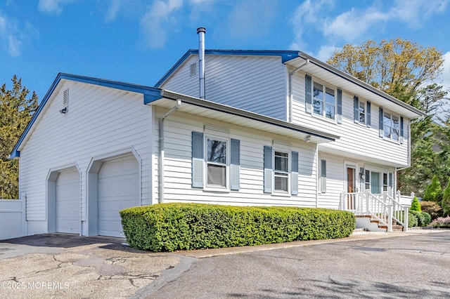 view of front of house with driveway and a garage