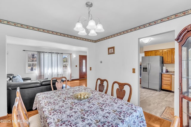 dining space with a notable chandelier