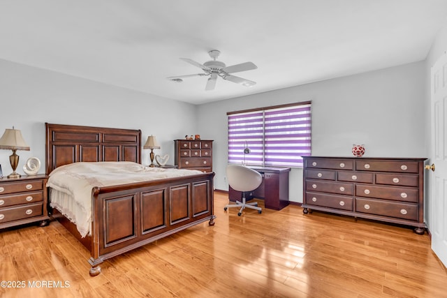 bedroom with ceiling fan and light wood finished floors