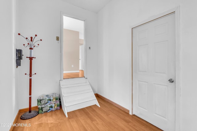 unfurnished bedroom with light wood-type flooring and baseboards