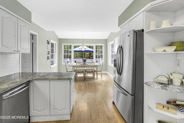 105 Tallwood Ln, Lincroft, NJ 07738 - kitchen with open shelves, light wood finished floors, appliances with stainless steel finishes, and a chandelier