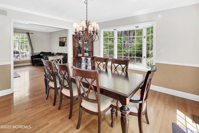 105 Tallwood Ln, Lincroft, NJ 07738 - dining space featuring crown molding, baseboards, an inviting chandelier, and light wood-type flooring