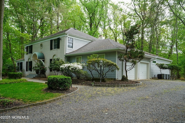 105 Tallwood Ln, Lincroft, NJ 07738 - colonial-style house featuring a garage, roof with shingles, driveway, and a chimney