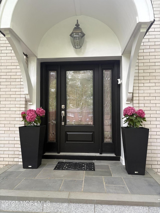 105 Tallwood Ln, Lincroft, NJ 07738 - property entrance with stucco siding and brick siding