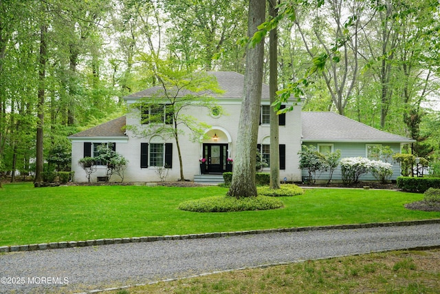 105 Tallwood Ln, Lincroft, NJ 07738 - colonial house featuring a front lawn and roof with shingles
