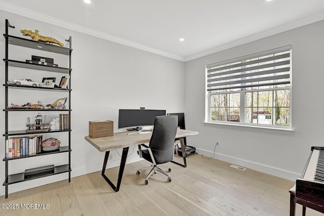 office space with visible vents, crown molding, baseboards, recessed lighting, and light wood-style flooring