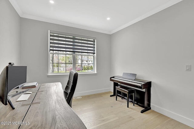 office space with visible vents, ornamental molding, wood finished floors, baseboards, and recessed lighting