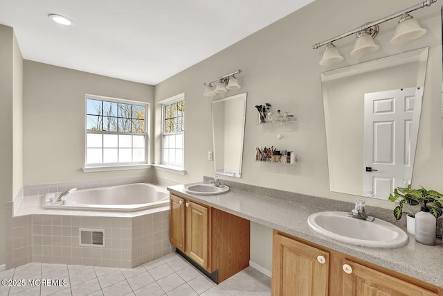 full bath with visible vents, a sink, tile patterned flooring, and double vanity