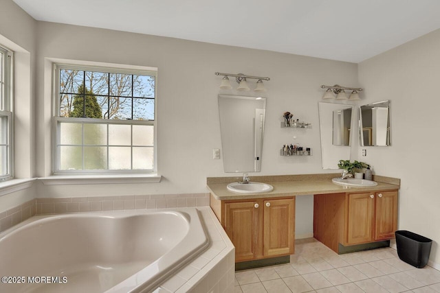 bathroom with double vanity, a sink, and a bath