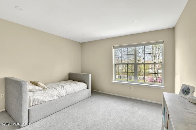 bedroom featuring carpet flooring and baseboards