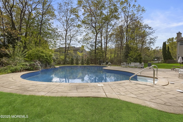 outdoor pool featuring a patio